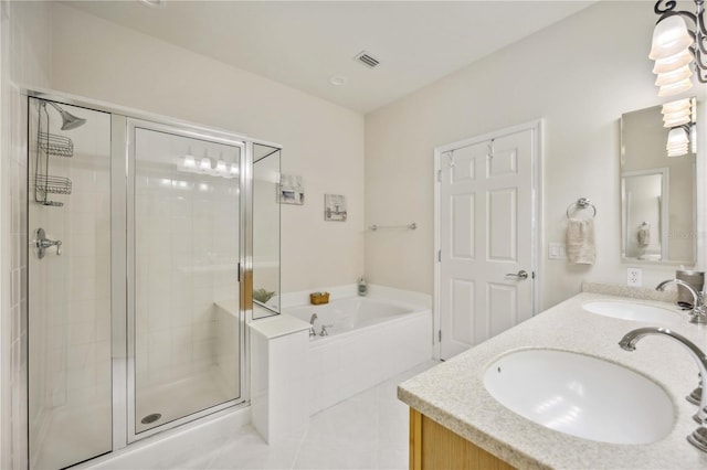 bathroom with plus walk in shower, vanity, and tile patterned floors