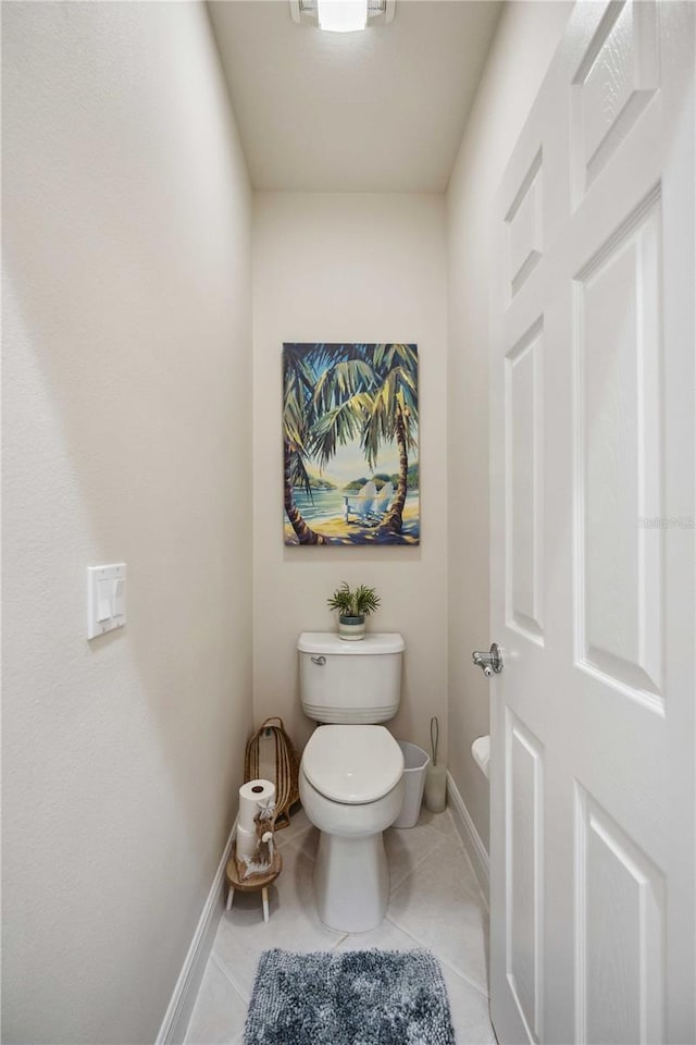 bathroom featuring tile patterned floors and toilet