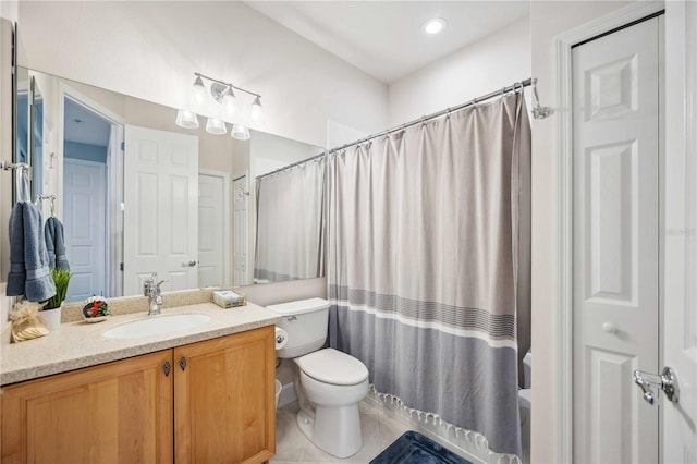 full bathroom featuring vanity, shower / tub combo, tile patterned floors, and toilet