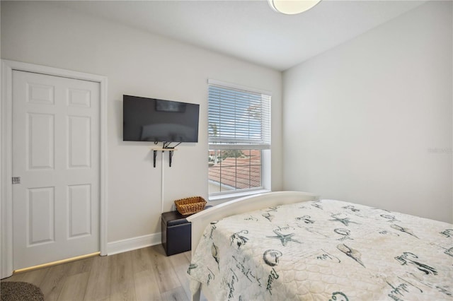 bedroom with hardwood / wood-style flooring