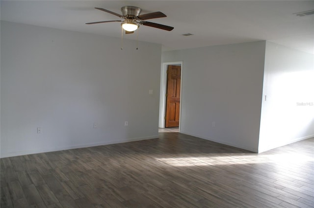 unfurnished room featuring ceiling fan and dark hardwood / wood-style floors