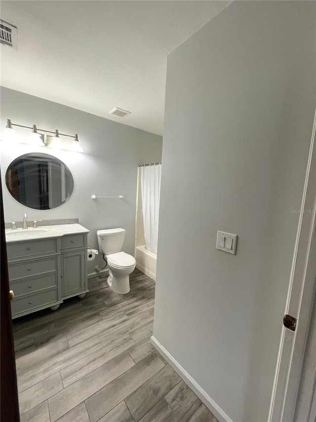 full bathroom with toilet, vanity, shower / tub combo, and hardwood / wood-style flooring