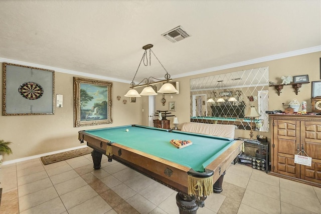 game room with pool table, ornamental molding, and light tile patterned flooring