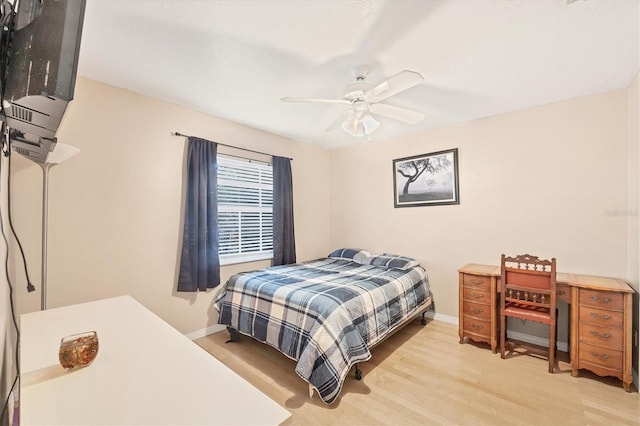 bedroom with ceiling fan and light hardwood / wood-style floors