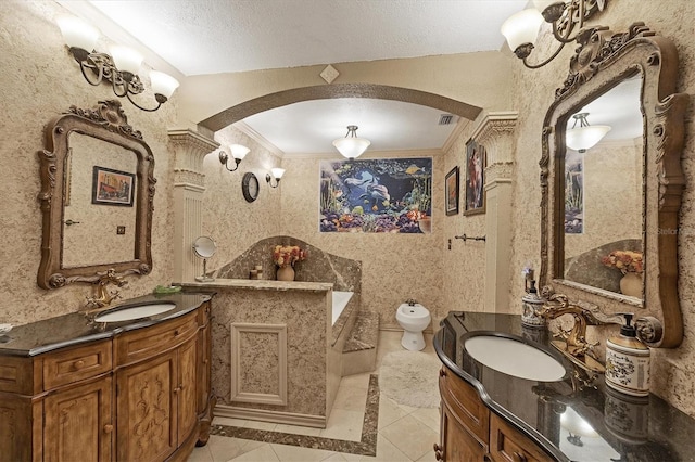 bathroom with crown molding, vanity, a bidet, and a textured ceiling