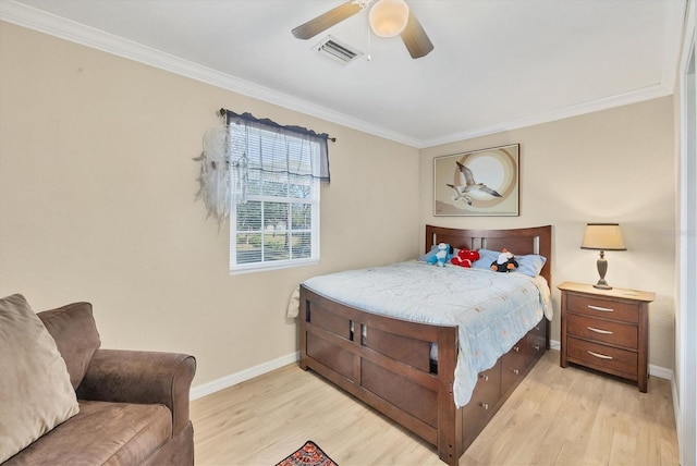 bedroom featuring ceiling fan, light hardwood / wood-style flooring, and ornamental molding