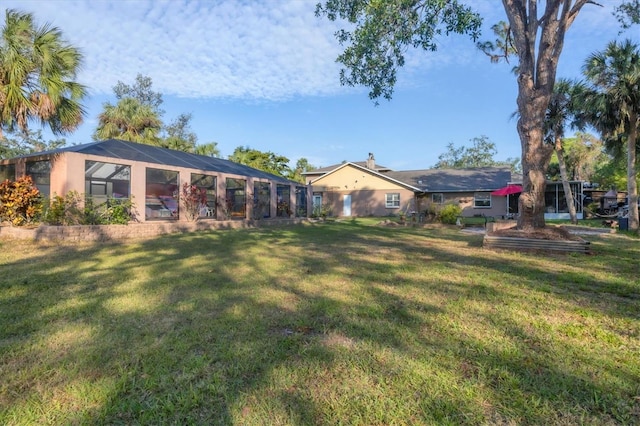 view of yard featuring a lanai