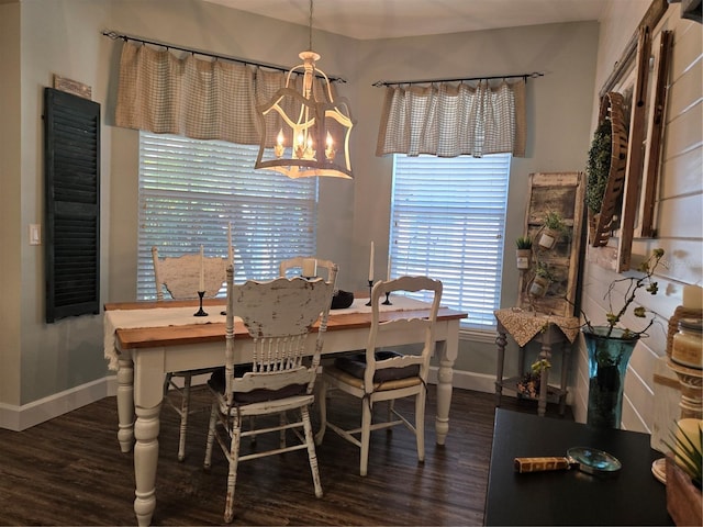 dining room featuring dark hardwood / wood-style floors and a notable chandelier