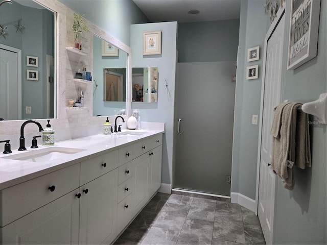 bathroom with vanity and an enclosed shower