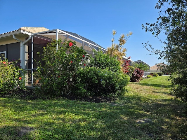 view of yard with a lanai