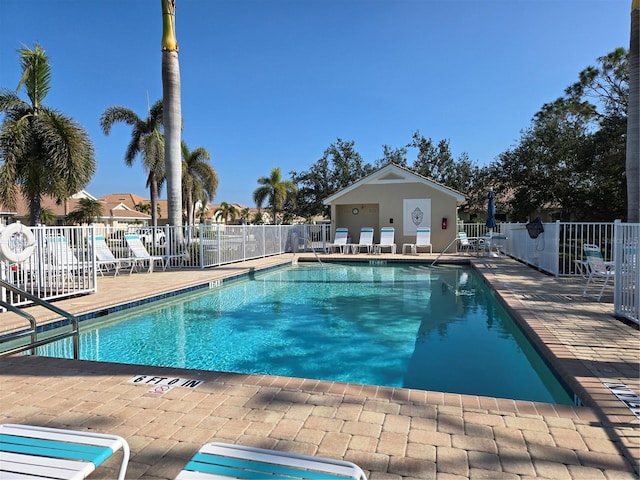 view of swimming pool featuring a patio area