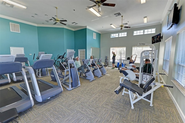 gym featuring carpet flooring and a towering ceiling