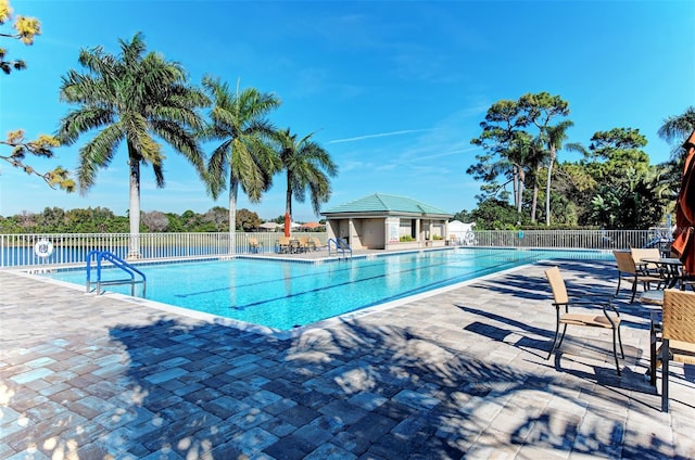 view of swimming pool with a patio area