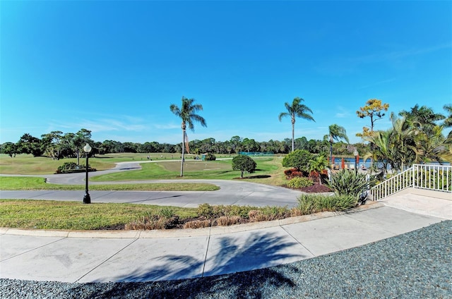 view of property's community with a lawn