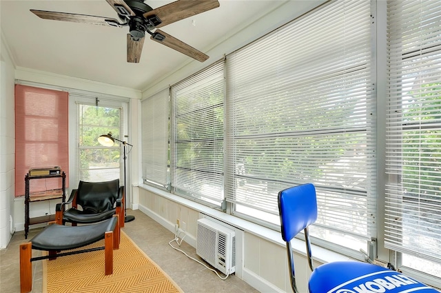 sunroom / solarium featuring ceiling fan and a wall unit AC