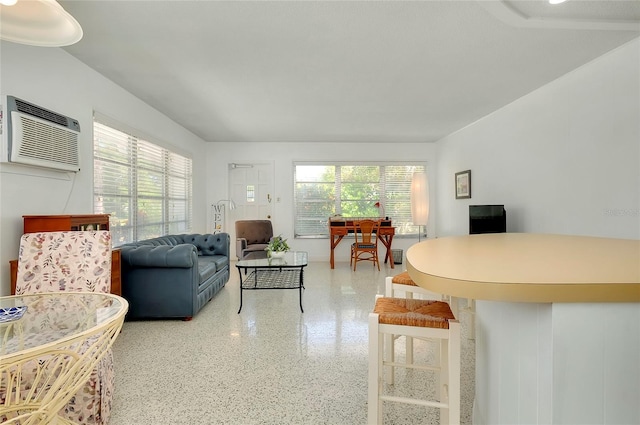 living room with a wall unit AC