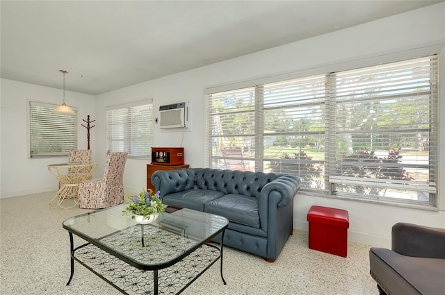 living room with a wall mounted air conditioner