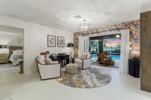 living room featuring light tile patterned floors and a chandelier