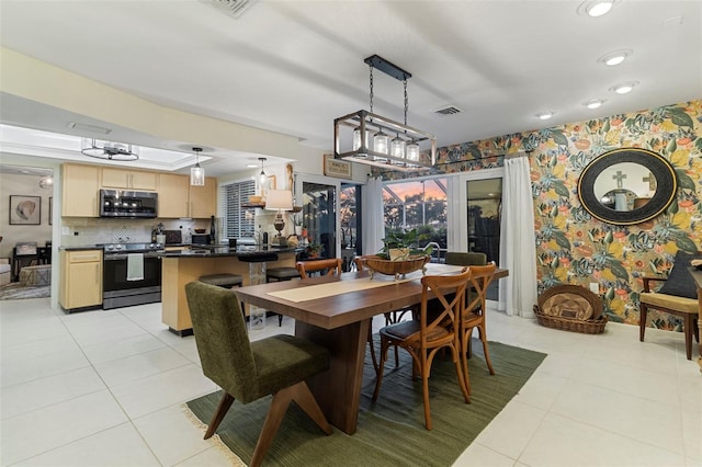 dining space featuring light tile patterned floors