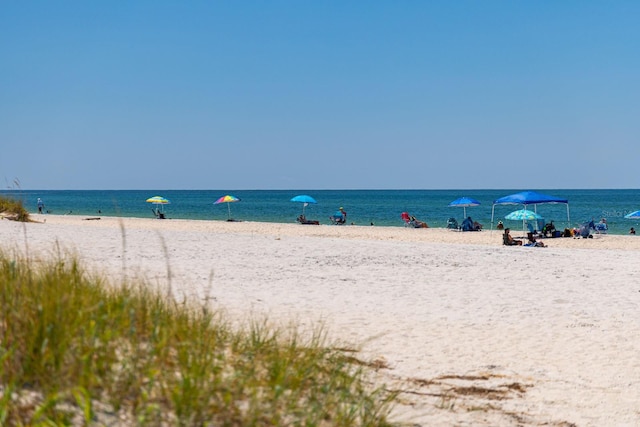 property view of water featuring a beach view