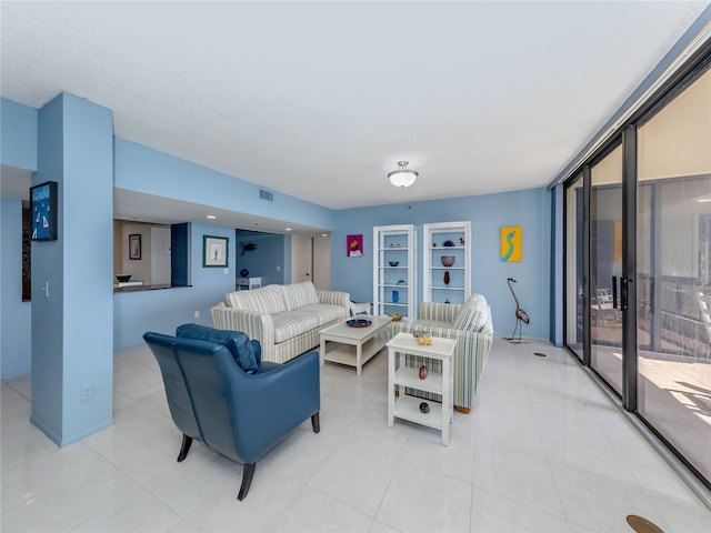 living room with a wall of windows