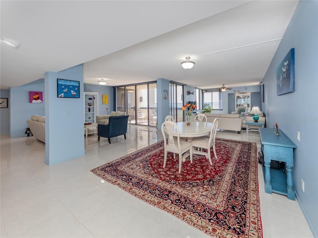 dining area featuring ceiling fan and light tile patterned floors