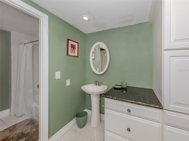 bathroom featuring shower / tub combo and tile patterned flooring