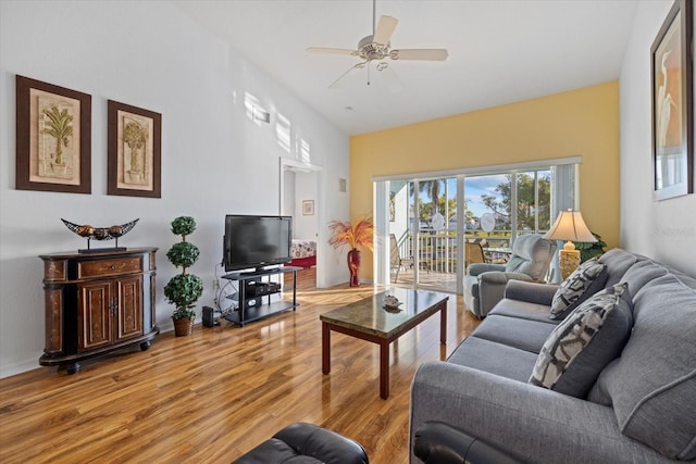 living room featuring light wood-type flooring and ceiling fan