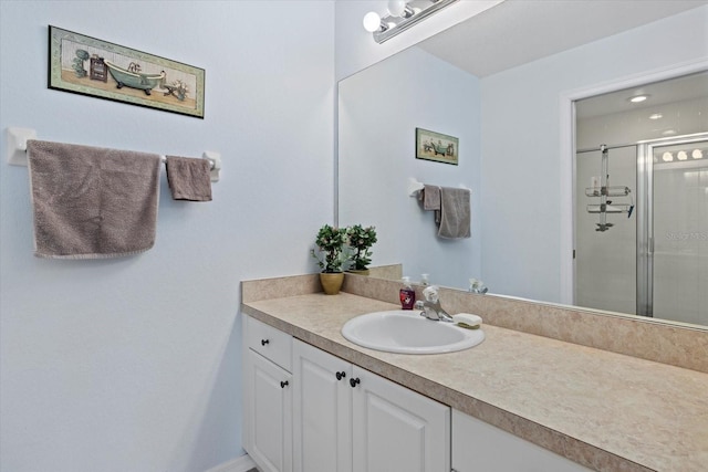 bathroom with vanity and walk in shower