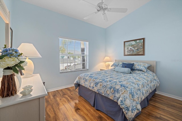 bedroom featuring ceiling fan and dark hardwood / wood-style floors