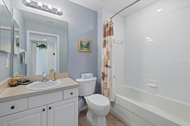 full bathroom featuring shower / bath combo, toilet, and vanity