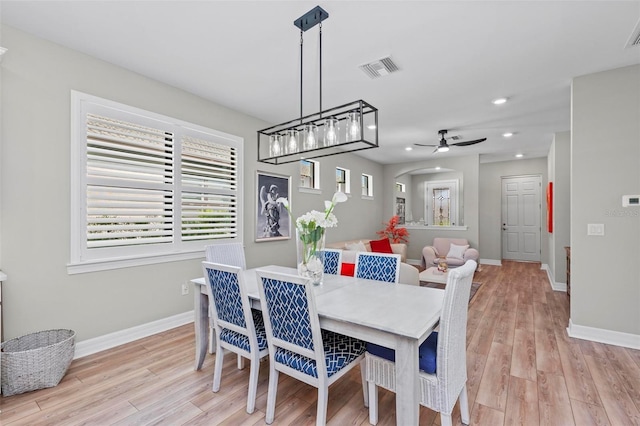 dining room featuring light hardwood / wood-style flooring and ceiling fan