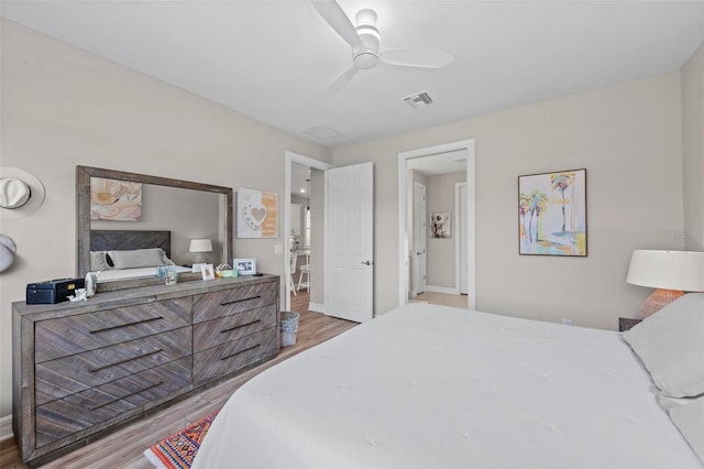 bedroom with hardwood / wood-style flooring and ceiling fan