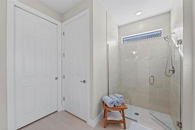 bathroom with tile patterned floors and an enclosed shower