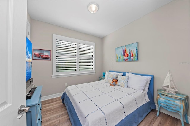 bedroom with light hardwood / wood-style flooring