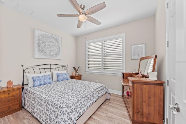 bedroom with ceiling fan and light hardwood / wood-style flooring