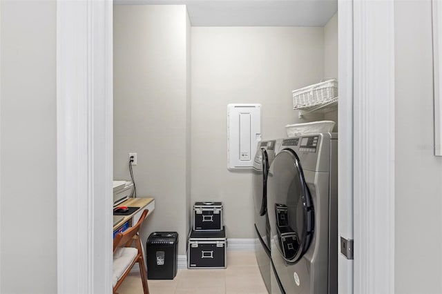 washroom featuring light tile patterned flooring and separate washer and dryer