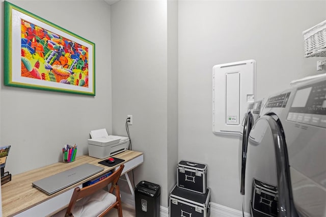 office area featuring washing machine and clothes dryer