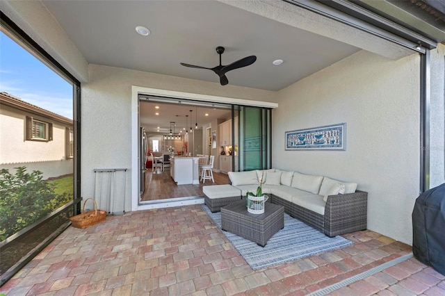 exterior space featuring ceiling fan