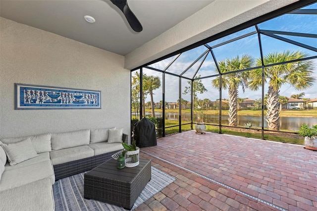 view of patio / terrace featuring an outdoor hangout area, a water view, and a lanai