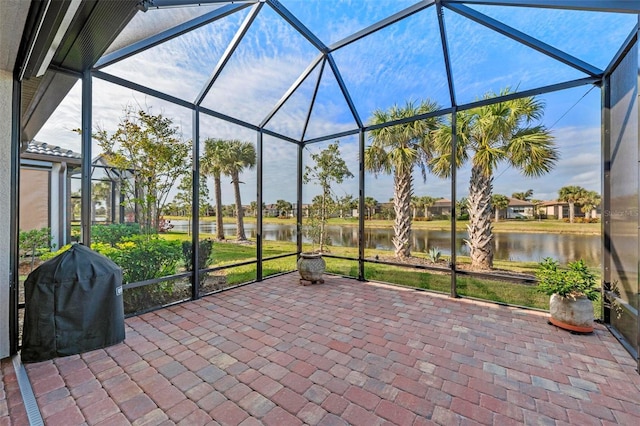 unfurnished sunroom with a water view