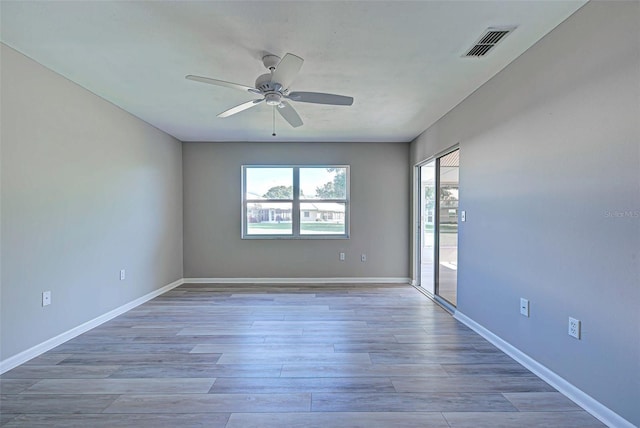 spare room with ceiling fan and light hardwood / wood-style flooring