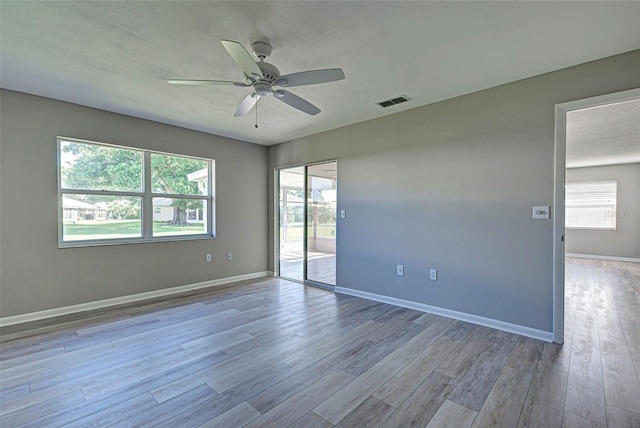 unfurnished room featuring ceiling fan and light hardwood / wood-style floors