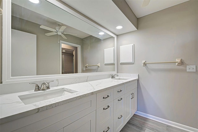 bathroom featuring ceiling fan, vanity, and hardwood / wood-style floors