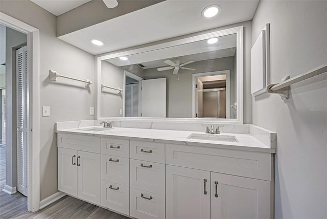 bathroom with vanity, hardwood / wood-style floors, and ceiling fan