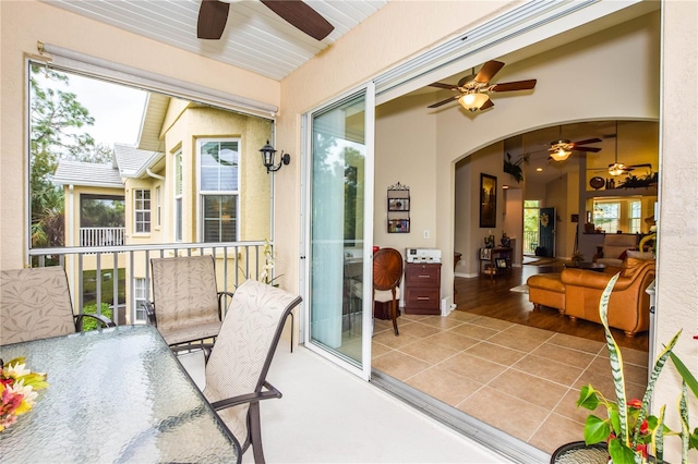 exterior space featuring ceiling fan