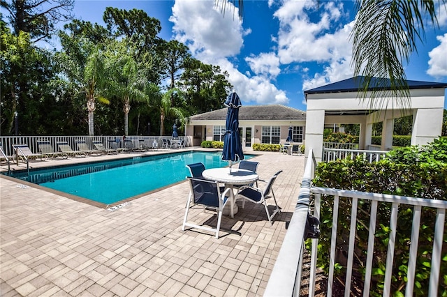 view of swimming pool featuring a gazebo and a patio