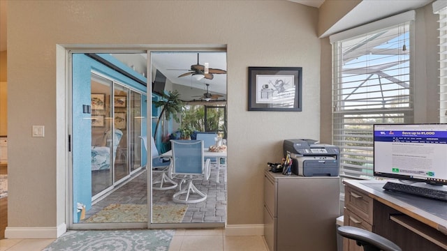 entryway featuring ceiling fan, vaulted ceiling, light tile patterned flooring, and plenty of natural light