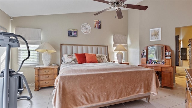 tiled bedroom featuring ceiling fan and vaulted ceiling