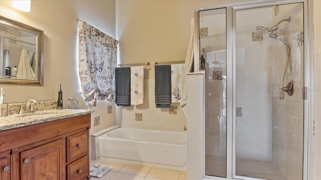 bathroom with vanity, tile patterned floors, and plus walk in shower